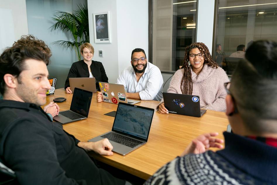Team of auditors collaborating on quality standards